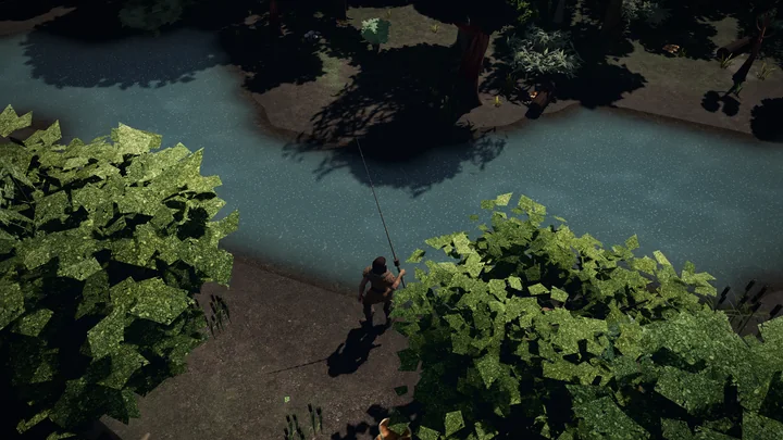 An angler fishes from a reedy riverbank at dusk.